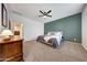 Comfortable main bedroom with carpet, ceiling fan and pleasant wall colors at 7236 W Townley Ave, Peoria, AZ 85345
