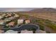 Gorgeous aerial view of a peaceful neighborhood with mature landscaping and breathtaking desert mountain views at 7973 S Peppertree Ct, Gilbert, AZ 85298