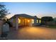Charming backyard with covered patio, brick pavers, and built-in grill perfect for outdoor dining at 7973 S Peppertree Ct, Gilbert, AZ 85298