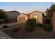 Beautiful single-Gathering home with a two-car garage, desert landscaping, and warm curb appeal at 7973 S Peppertree Ct, Gilbert, AZ 85298