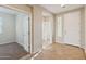 Inviting entryway with tiled flooring, neutral walls, and carpeted room to the left at 7973 S Peppertree Ct, Gilbert, AZ 85298