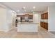 Bright kitchen with granite countertops, a stainless steel refrigerator, and custom cabinetry at 7973 S Peppertree Ct, Gilbert, AZ 85298