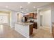 Modern kitchen with stainless steel appliances, granite countertops, and a spacious island, perfect for cooking at 7973 S Peppertree Ct, Gilbert, AZ 85298
