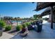 Relaxing outdoor seating area with a beautiful view of the community pool, playground, and surrounding landscape at 7973 S Peppertree Ct, Gilbert, AZ 85298