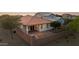 Aerial view of the backyard featuring a covered patio and brick pavers for outdoor living at 7973 S Peppertree Ct, Gilbert, AZ 85298