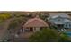 Aerial view of the backyard highlighting the covered patio, and the private pool at 7973 S Peppertree Ct, Gilbert, AZ 85298