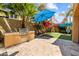 Enjoy outdoor cooking with this backyard's built-in grill and entertain under the bright blue patio umbrella at 9132 S Parkside Dr, Tempe, AZ 85284