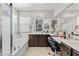 Bright bathroom features a soaking tub, a large vanity with dual sinks, and ample counter space at 9132 S Parkside Dr, Tempe, AZ 85284