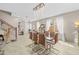 Open-concept dining area with a staircase and chandelier, perfect for Gathering meals and gatherings at 9132 S Parkside Dr, Tempe, AZ 85284