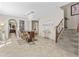 Dining room featuring a modern chandelier, tile floors, and a staircase to the second floor at 9132 S Parkside Dr, Tempe, AZ 85284