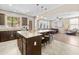 Spacious kitchen with granite countertops, a large island, stainless steel appliances, and ample seating at 9132 S Parkside Dr, Tempe, AZ 85284