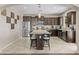 Well-lit kitchen with stainless appliances, granite countertops, and a large center island with seating at 9132 S Parkside Dr, Tempe, AZ 85284