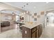Open concept kitchen with granite countertops, stainless steel appliances, and breakfast bar seating at 9132 S Parkside Dr, Tempe, AZ 85284
