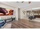 Cozy living room featuring a mounted flat screen TV and hardwood flooring at 9132 S Parkside Dr, Tempe, AZ 85284