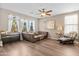 Comfortable living room with natural light, plush seating, and ceiling fan at 9132 S Parkside Dr, Tempe, AZ 85284
