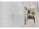 Walk-in pantry with custom cabinets and shelving, great for organized storage of dry goods at 9132 S Parkside Dr, Tempe, AZ 85284