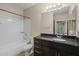Bathroom featuring modern vanity, framed mirror, and shower-tub combo at 945 E Playa Del Norte Dr # 1022, Tempe, AZ 85288