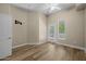Bright bedroom with wood floors, ceiling fan, and sliding glass door at 945 E Playa Del Norte Dr # 1022, Tempe, AZ 85288