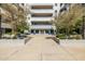 Entrance to courtyard features greenery, blue planters and building entryway at 945 E Playa Del Norte Dr # 1022, Tempe, AZ 85288