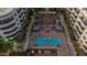 Aerial view of a community courtyard with a pool, lounge chairs, and lush landscaping at 945 E Playa Del Norte Dr # 1022, Tempe, AZ 85288