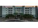 Well-maintained apartment building exterior with elegant landscaping and a welcoming entrance at 945 E Playa Del Norte Dr # 1022, Tempe, AZ 85288