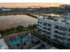 Scenic view of apartments by the water with palm trees and a glimpse of a luxurious pool area at 945 E Playa Del Norte Dr # 1022, Tempe, AZ 85288