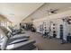 Well-equipped gym featuring treadmills, weight machines, and ceiling fans at 945 E Playa Del Norte Dr # 1022, Tempe, AZ 85288