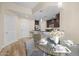 Kitchen and dining area, featuring pendant lighting and dark wood cabinets at 945 E Playa Del Norte Dr # 1022, Tempe, AZ 85288