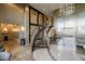 Elegant lobby with marble floors, staircase, metal wall details, and decorative lighting at 945 E Playa Del Norte Dr # 1022, Tempe, AZ 85288