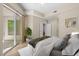 Cozy bedroom with a view of the balcony and ensuite bathroom access at 945 E Playa Del Norte Dr # 1022, Tempe, AZ 85288