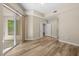 Bedroom with light wood floors, sliding glass doors to the balcony, and ensuite bathroom access at 945 E Playa Del Norte Dr # 1022, Tempe, AZ 85288