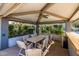 Comfortable covered outdoor dining space with ceiling fan and lush greenery surrounding the seating area at 945 E Playa Del Norte Dr # 1022, Tempe, AZ 85288