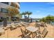 Inviting outdoor seating area featuring views of water, palm trees, and modern architectural features at 945 E Playa Del Norte Dr # 1022, Tempe, AZ 85288
