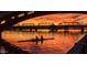 Silhouette of rowers on river at sunset, framed by the underside of a bridge at 945 E Playa Del Norte Dr # 1022, Tempe, AZ 85288