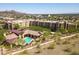 Aerial view showcasing community pool area amidst well-maintained apartment complex, with city and mountain views at 9820 N Central Ave # 307, Phoenix, AZ 85020