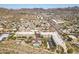 Aerial view of apartment complex with desert landscape, revealing community pool and convenient access to the city at 9820 N Central Ave # 307, Phoenix, AZ 85020