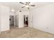 A bedroom with carpet and an open door to the kitchen at 9820 N Central Ave # 307, Phoenix, AZ 85020