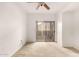 A bedroom with sliding glass doors and a ceiling fan offers ample natural light and fresh air at 9820 N Central Ave # 307, Phoenix, AZ 85020