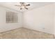 A bedroom with carpet and a ceiling fan at 9820 N Central Ave # 307, Phoenix, AZ 85020