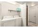 The laundry room, equipped with a washer and dryer, ensures convenient chore management at 9820 N Central Ave # 307, Phoenix, AZ 85020