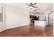 Open concept living area with wood-look floors, kitchen, and natural light at 9820 N Central Ave # 307, Phoenix, AZ 85020
