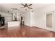 Living area featuring wood floors and access to kitchen and balcony at 9820 N Central Ave # 307, Phoenix, AZ 85020