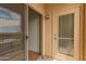 View from balcony featuring an open sliding glass door and separate door to the exterior at 9820 N Central Ave # 324, Phoenix, AZ 85020