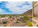 View from balcony overlooking the city, adjacent hill, and parking area at 9820 N Central Ave # 324, Phoenix, AZ 85020