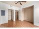 Bedroom with hardwood floors, neutral walls, and walk-in closet space at 9820 N Central Ave # 324, Phoenix, AZ 85020