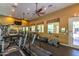Community gym with various exercise machines and natural light from several windows at 9820 N Central Ave # 324, Phoenix, AZ 85020