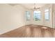 Bright and airy living room with wood floors, multiple windows, and a ceiling fan at 9820 N Central Ave # 324, Phoenix, AZ 85020