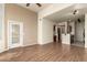 Open-concept living space with high ceilings, modern flooring, and a view of the updated kitchen at 9820 N Central Ave # 324, Phoenix, AZ 85020