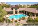 Aerial view of pool and clubhouse offering a refreshing escape and social gatherings at 9820 N Central Ave # 324, Phoenix, AZ 85020