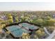 Aerial view of a community tennis courts with city views in a well-maintained community at 9865 E Piedra Dr, Scottsdale, AZ 85255